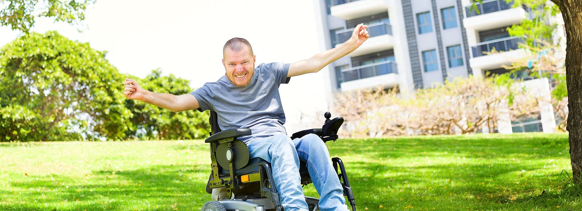 cheerful man at the wheelchair